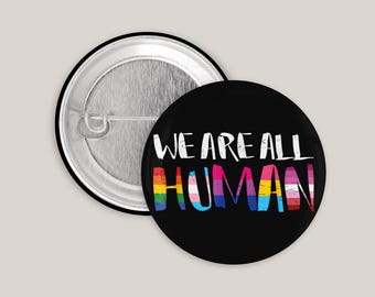 We Are All Human Button – LGBTQ+ Pride Badge for Jacket, Backpack & Bag