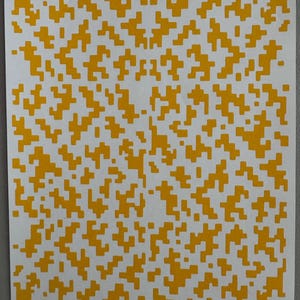 May include: A white sheet of paper with a repeating pattern of yellow, pixelated shapes. The shapes are irregular and create a textured appearance across the surface. The design is symmetrical, with a central focus.