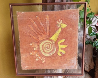 May include: A framed artwork depicting a stylized yellow bird with a red and orange handprint design on a brown background.