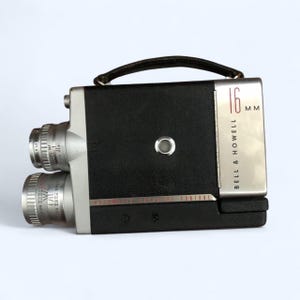 Kamera filmowa Bell & Howell 200EE z elektryczną migawką 16 mm i obiektywem/sprawdzona w działaniu
