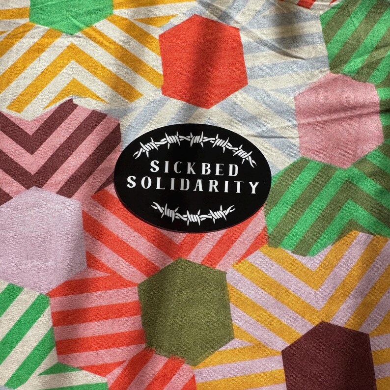 SICKBED SOLIDARITY | black and white, barbed wire, oval sticker on colourful background