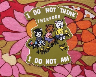 May include: A green sticker with the text "I do not think therefore I do not am" and a cartoon illustration of three cats sitting on a branch with birds.
