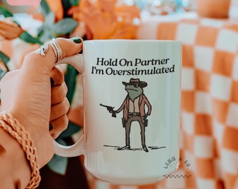Hold On Partner Im Overstimulated Frog Mug | Funny Frog Mug | Cowboy Frog Coffee Cup | Western Drinkware | Ceramic Mug 11oz 15oz