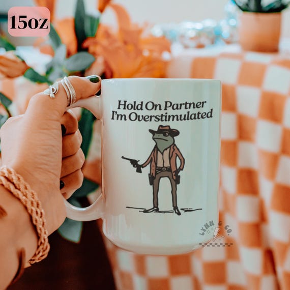 Hold On Partner Im Overstimulated Frog Mug | Funny Frog Mug | Cowboy Frog Coffee Cup | Western Drinkware | Ceramic Mug 11oz 15oz