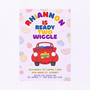 May include: A birthday party invitation with the text "Rhiannon is Ready Two Wiggle." The invitation features a red cartoon car and fruit illustrations on a light purple background. The Wiggles logo is on the car.