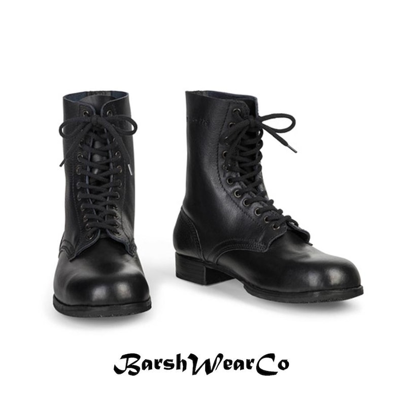 May include: Two black leather combat boots with lace-up closures. The boots have a mid-calf height and a sturdy sole. The brand name "BarshWearCo" is displayed at the bottom of the image.