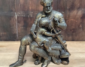 Vintage Bronzed Figure Seated Knight with Child Grabbing his Sword A Scolding