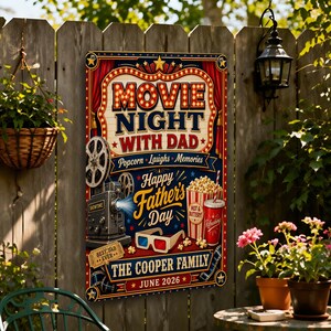 May include: A rectangular sign with a movie night theme, featuring the text "MOVIE NIGHT WITH DAD" and "Happy Father's Day." The sign includes images of a film reel, a vintage projector, 3D glasses, popcorn, and a soda. The sign is mounted on a wooden fence.