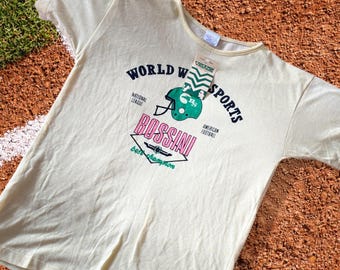 Vintage 1980s Bossini “World Wide Sports” American Football T-Shirt – Yellow Visage Tee – Retro Sports Graphic – Made in Hong Kong – Size S