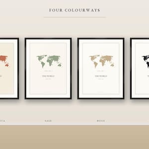 May include: Four framed wall art prints featuring world map illustrations in terracotta, sage, beige, and black. Each print includes the text THE WORLD centred below the map. The prints are displayed in black frames against a light background.