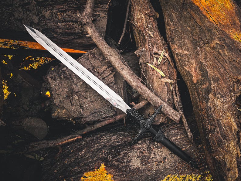May include: A long, silver sword with a black handle and ornate guard rests on a bed of weathered wood. The blade is sharp and reflective, contrasting with the dark, textured background. The sword's design suggests a fantasy or historical theme.