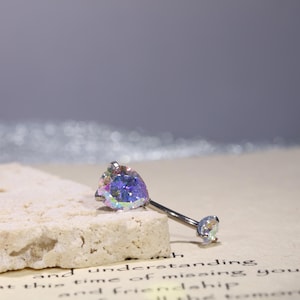 May include: A handmade wooden chopping board with a natural finish. The board has a live edge on one side and a rectangular shape. It's approx. 45 cm long and 30 cm wide.