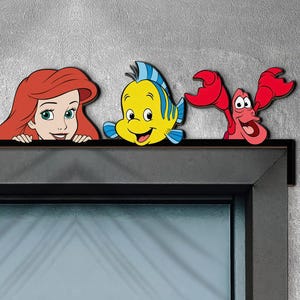 May include: A rustic wooden sign with the text "Welcome to our home" in white lettering. The sign features a distressed finish and a simple, inviting design, perfect for a front porch or entryway.