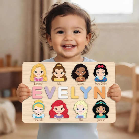A hand-cut wooden name puzzle shaped around princess motifs — genuinely custom per order, educational, and the kind of heirloom baby gift that gets kept for years.