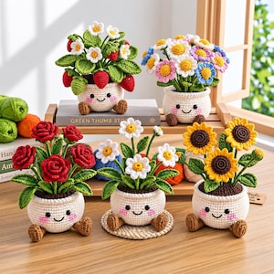 May include: Five crocheted potted plants with smiling faces, pink cheeks, and small brown feet. The plants include strawberries with white flowers, multi-colored daisies, red roses, white daisies, and yellow sunflowers in cream-colored pots.