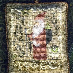 Stitching Joy 2010 Annual Santa Ornament  (Includes the charm)