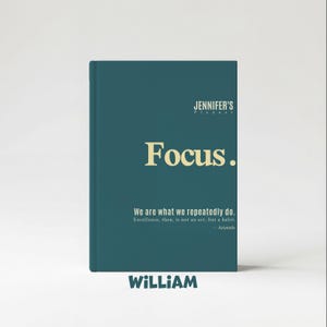 May include: A teal-colored planner with the text "Focus." in a bold, gold font. The planner includes the text "JENNIFER'S Planner" at the top and a quote by Aristotle. The name "WILLIAM" is at the bottom.