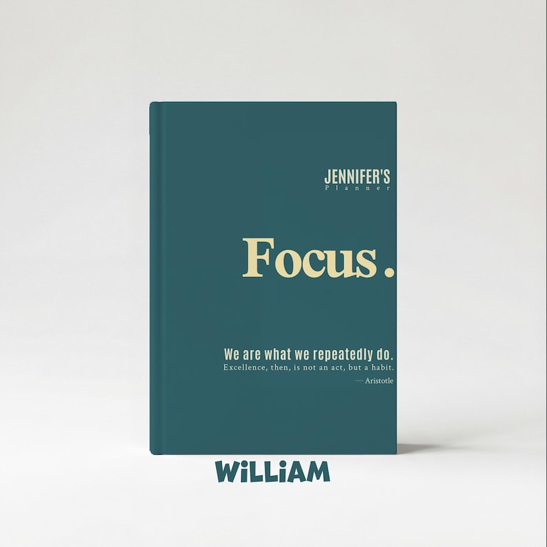 May include: A teal-colored planner with the text "Focus." in a bold, gold font. The planner includes the text "JENNIFER'S Planner" at the top and a quote by Aristotle. The name "WILLIAM" is at the bottom.
