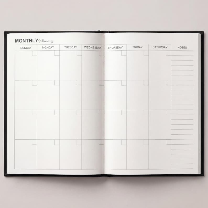 May include: Open black notebook with a monthly planning layout. The left page displays a calendar grid with days of the week across the top. The right page has a notes section. The words "MONTHLY Planning" are at the top.