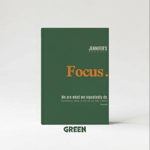May include: A green planner with the text "JENNIFER'S Planner" at the top and the word "Focus." in orange. Below, it reads "We are what we repeatedly do." and "Excellence, then, is not an act, but a habit. Aristotle." The word "GREEN" is at the bottom.