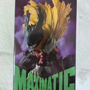 May include: A MAXIMATIC figure from the My Hero Academia series. The figure features a character with a black and yellow cape, gray hands, and a dark outfit. The box has the series logo and the word MAXIMATIC in green.