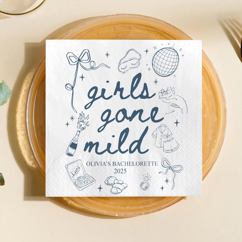 May include: White paper napkin with blue illustrations and text. The text reads "girls gone mild" with additional text "Olivia's Bachelorette 2025". The napkin features drawings of a disco ball, champagne bottle, and pajamas.