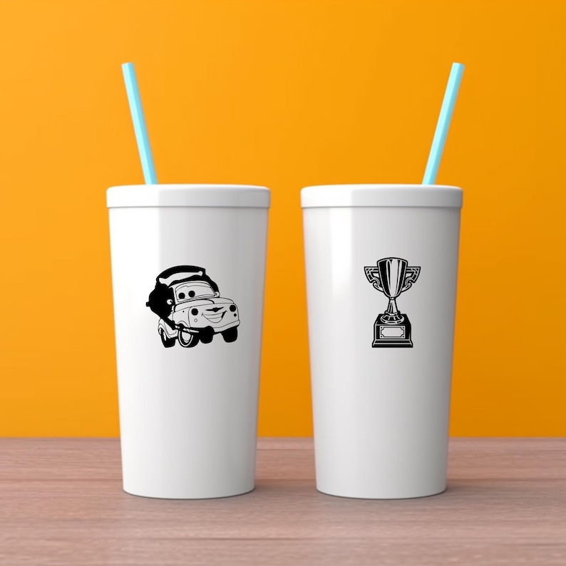 May include: Two white tumblers with blue straws. One tumbler features a black cartoon car graphic, and the other has a black trophy graphic. The background is a solid orange color.