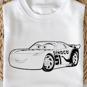 May include: White sweatshirt featuring a black and white graphic of a cartoon race car. The car has the word "DINOCO" and the number "51" printed on it. The car has a smiling face.