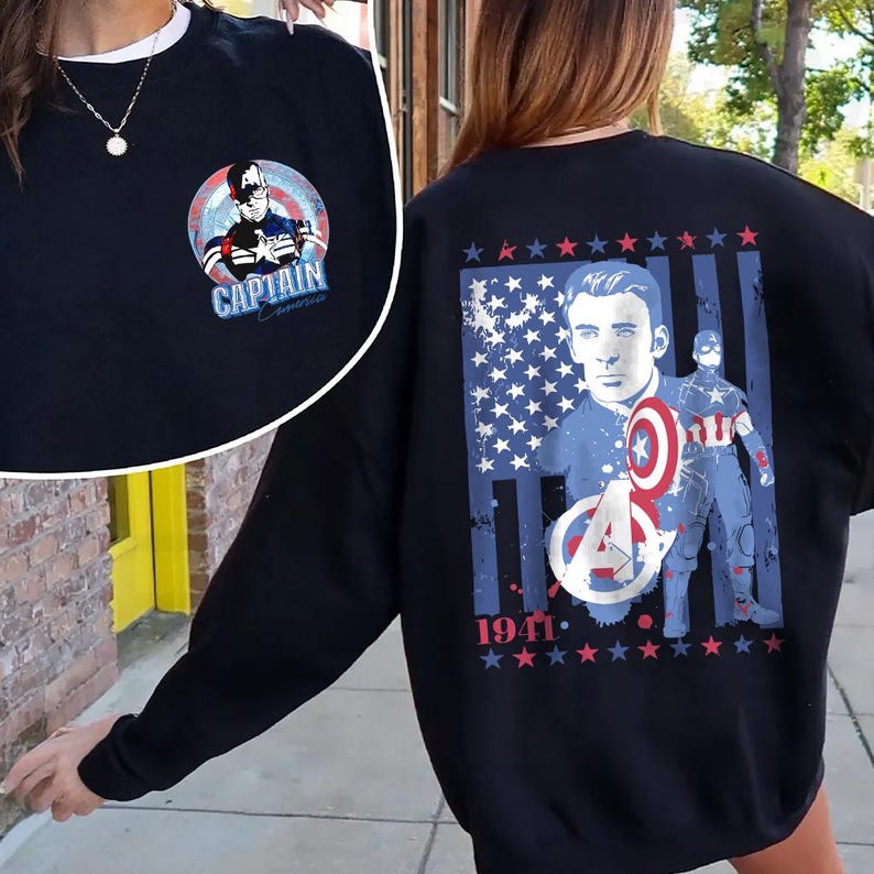 May include: Black sweatshirt featuring Captain America graphics. The front has a circular design with Captain America and the text "CAPTAIN AMERICA". The back displays a portrait, shield, and the year "1941" with stars and stripes.