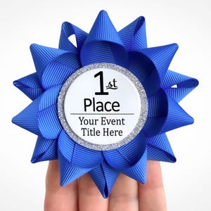 May include: A blue ribbon with a silver glitter circle that says "1st Place" and "Your Event Title Here".