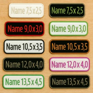 Peut inclure: Plusieurs écussons rectangulaires avec le mot "Name" et des dimensions variées. Les couleurs incluent le blanc, le noir, le rouge, le vert, l'orange et le rose, avec des tailles allant de 7,5 x 2,5 à 13,5 x 4,5 cm.