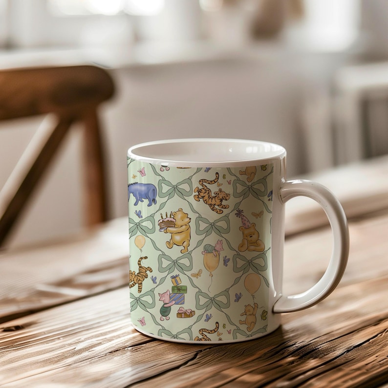 May include: White ceramic mug featuring a repeating pattern of Winnie the Pooh characters, bows, and balloons on a light green background. The design includes Pooh Bear with a cake, tigers, and other characters.