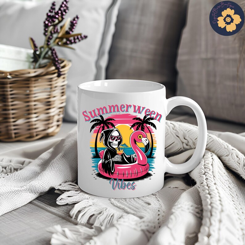 May include: White ceramic mug featuring a graphic of a Grim Reaper in a black robe and sunglasses, holding a cocktail while floating on a pink flamingo float. The mug has the words "Summerween Vibes" in pink and teal.