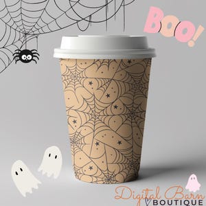 May include: A tan disposable coffee cup with a white lid, featuring a black spiderweb and star pattern. The word "Boo!" is in pink, with two ghost illustrations and a spider. The text "Digital Barn Boutique" is at the bottom.