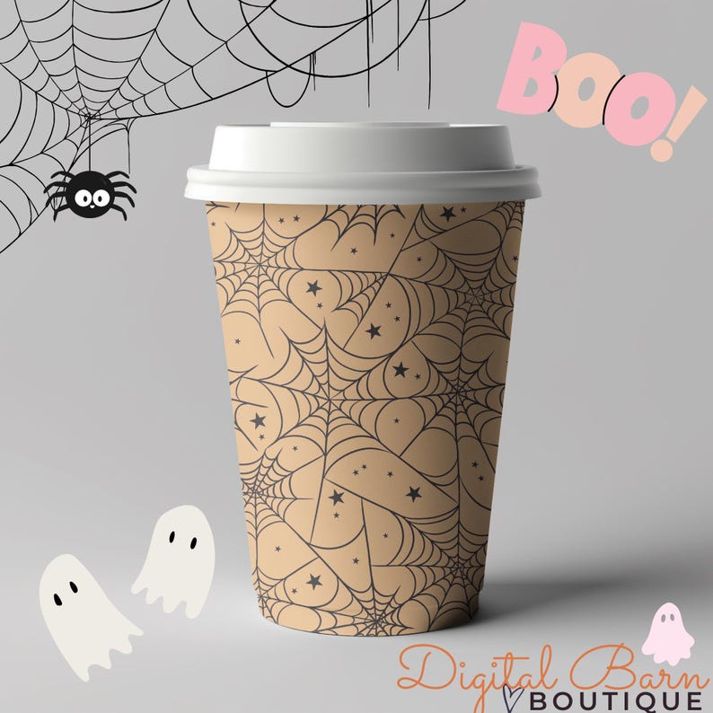 May include: A tan disposable coffee cup with a white lid, featuring a black spiderweb and star pattern. The word "Boo!" is in pink, with two ghost illustrations and a spider. The text "Digital Barn Boutique" is at the bottom.