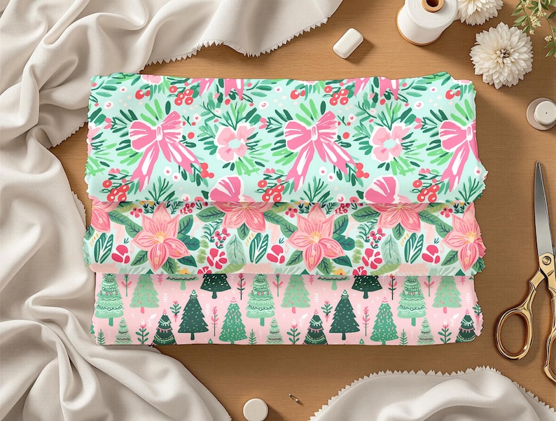 May include: Three folded fabric pieces with festive patterns. The top fabric has a mint green background with pink bows and floral designs. The middle fabric features pink poinsettias and greenery. The bottom fabric has a pink background with green Christmas trees.