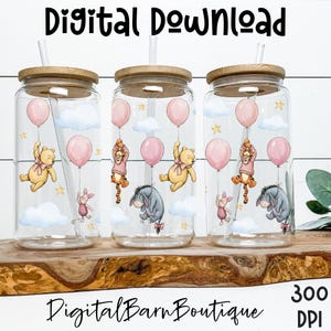 May include: Three clear glass tumblers with wooden lids and straws. Each tumbler features a design of Winnie the Pooh characters with pink balloons, clouds, and stars. The text "Digital Download" and "Digital Barn Boutique" are visible.