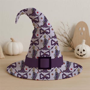 May include: A purple witch hat with a wide brim and a pointed top. The hat features a repeating pattern of a queen holding an apple, bows, and red apples. A dark purple band with a square buckle encircles the hat.