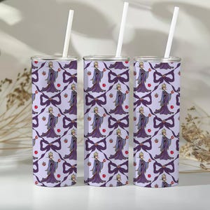 May include: Three stainless steel tumblers with white straws. Each tumbler features a repeating pattern of a purple Evil Queen holding an apple, with purple bows and red apples on a light purple background.