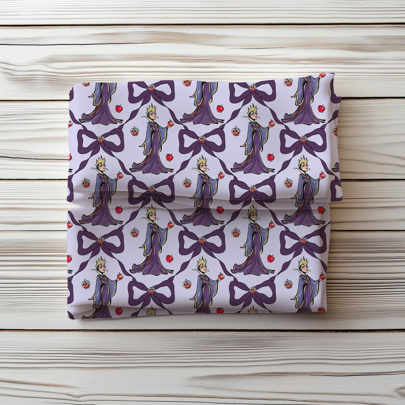 May include: Folded fabric with a repeating pattern of a queen holding an apple, bows, and apples. The queen wears a purple gown and crown. The bows are dark purple, and the apples are red.
