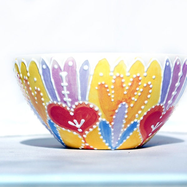 Bright bowl in yellow, orange, pinks and purples