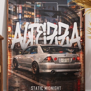 May include: Framed art print featuring a silver sports car with a spoiler, set against a blurred cityscape backdrop. The word "ALTERRA" is written in large white graffiti-style letters. The text "STATIC MIDNIGHT" is also visible.