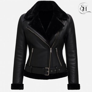 May include: Black leather jacket with a faux fur collar and lining. The jacket features a belted waist, zippered pockets, and cuffs with faux fur trim. The jacket has a classic biker style.