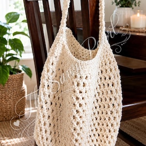 May include: A cream-coloured crochet tote bag featuring an open-work diamond pattern and a single shoulder strap. The bag is constructed from thick yarn with a textured, knotted appearance, showcasing a spacious interior and a slouchy silhouette.