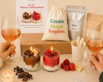 May include: A DIY candle making kit featuring a cardboard box, a drawstring bag with the text Create Shape Inspire, a silver pouch labeled WAX, two glass candles resembling desserts, a paper cup, a small bottle, and decorative wax pieces.