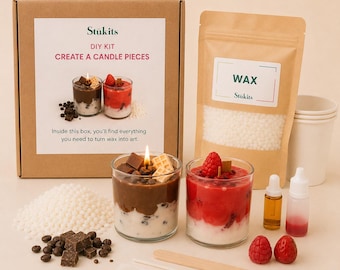 May include: A DIY candle making kit featuring a cardboard box labeled Stukits Create a Candle Pieces, a pouch of white wax beads, two glass candles with chocolate and berry designs, fragrance oils, a wooden stirrer, and decorative wax toppings.