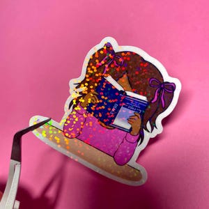 Girl reading and studying DSM-5 sticker featuring a cute girl wearing pink with bows in her brunette hair, psychology humor sticker for grad students and therapists