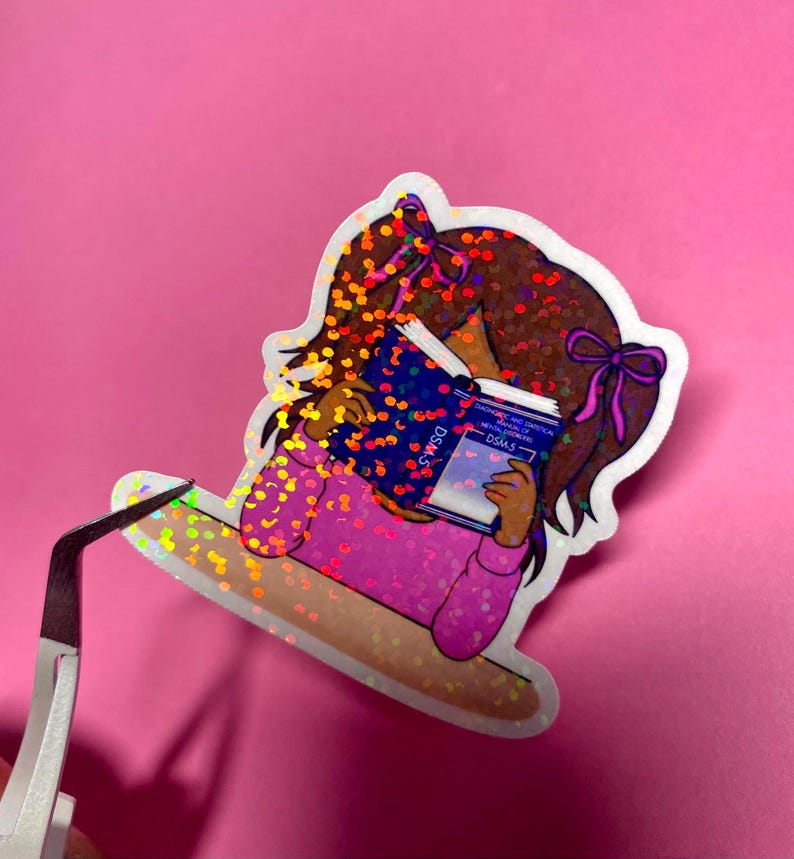 Girl reading and studying DSM-5 sticker featuring a cute girl wearing pink with bows in her brunette hair, psychology humor sticker for grad students and therapists