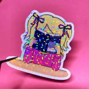 Girl reading and studying DSM-5 sticker featuring a cute girl wearing pink with bows in her blonde hair, psychology humor sticker for grad students and therapists