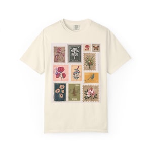 Camiseta vintage con sello floral, ideal para amantes de los viajes, ropa de verano, moda ecológica, colores cómodos.